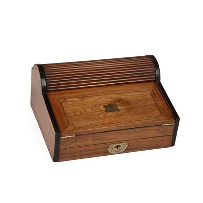 Lot 147 - A Victorian campaign camphor wood roll top...