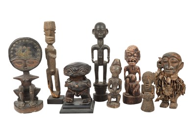 Lot 214 - A collection of eight African tribal carved...