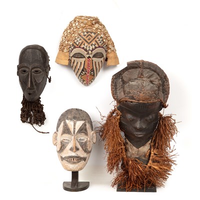Lot 218 - Four African tribal masks to include a Pende,...