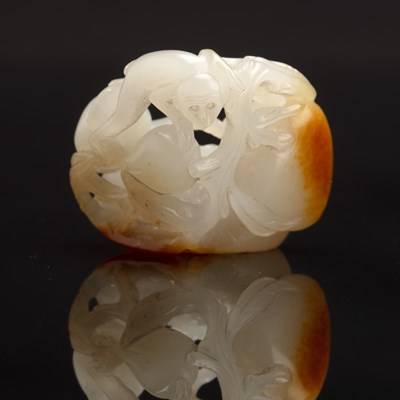 Lot 192 - White and russet jade ‘monkey and peach’ group...