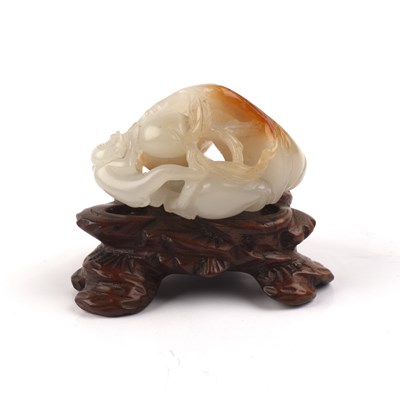 Lot 192 - White and russet jade ‘monkey and peach’ group...