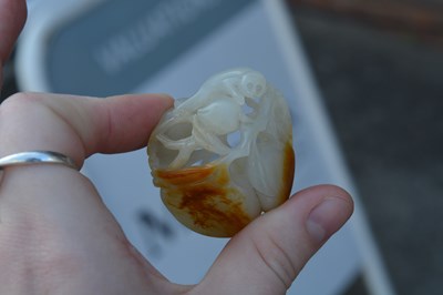 Lot 192 - White and russet jade ‘monkey and peach’ group...