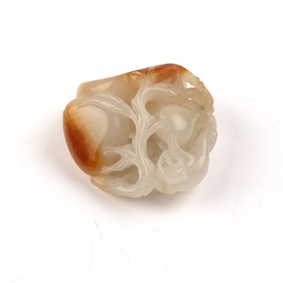 Lot 192 - White and russet jade ‘monkey and peach’ group...