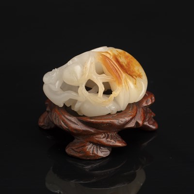 Lot 192 - White and russet jade ‘monkey and peach’ group...