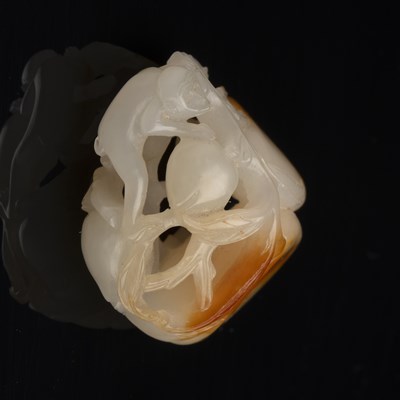 Lot 192 - White and russet jade ‘monkey and peach’ group...