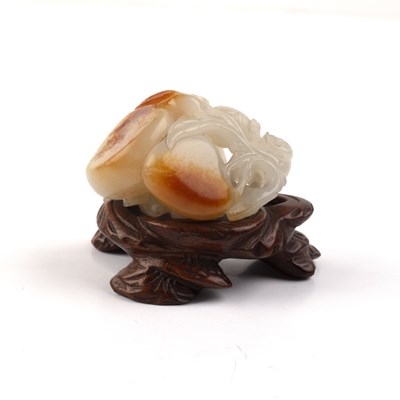 Lot 192 - White and russet jade ‘monkey and peach’ group...