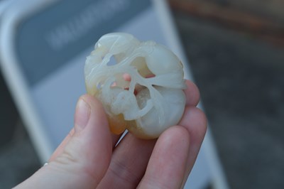 Lot 192 - White and russet jade ‘monkey and peach’ group...