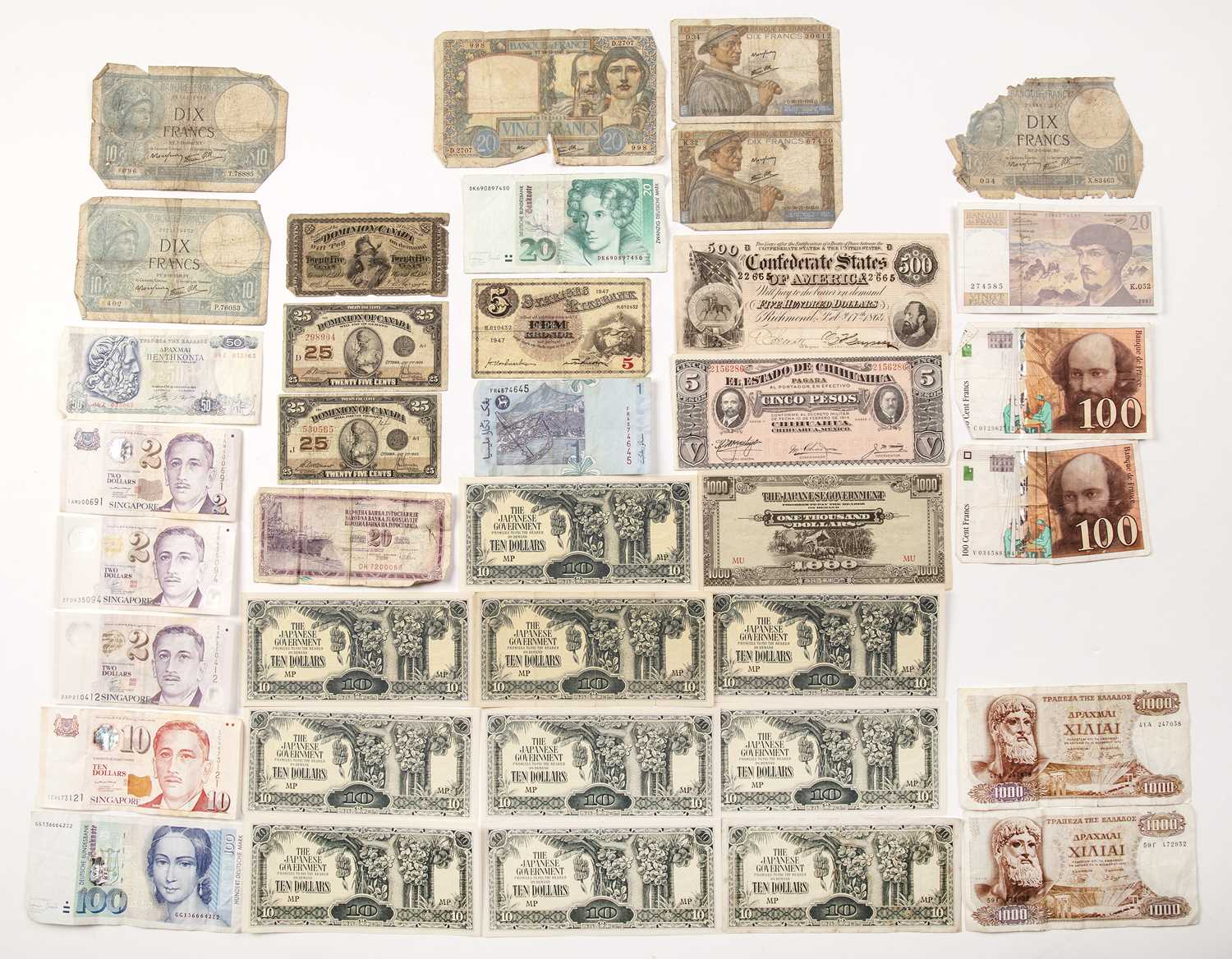 Lot 317 - A collection of bank notes to include a $500...