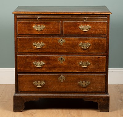 Lot 1131 - A country-made oak chest of drawers