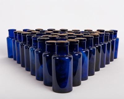 Lot 280 - A collection of forty-five blue glass bottles