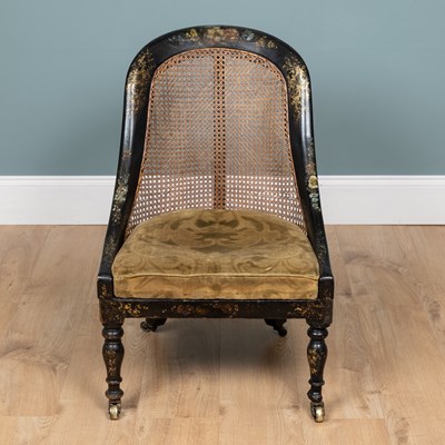 Lot 401 - A Victorian ebonised bergère chair