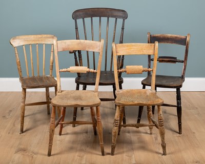 Lot 1140 - A group of five rustic chairs