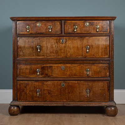 Lot 1175 - A Queen Anne walnut cottage-cut chest of drawers