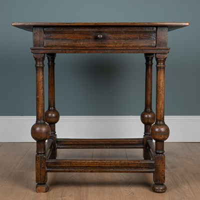 Lot 1015 - An 18th century oak side table