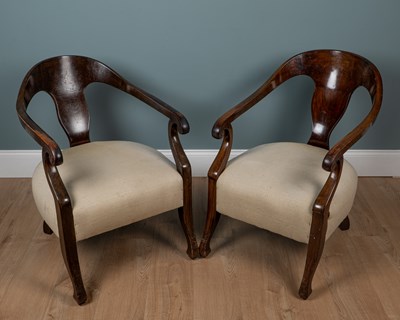 Lot 44 - A near pair of late 19th century mahogany-framed smoker's chairs