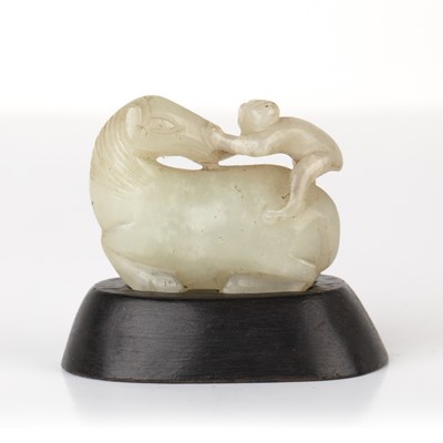 Lot 245 - Small pale green jade model of a horse and...