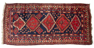 Lot 241 - A Persian long rug by the Luri tribe with...