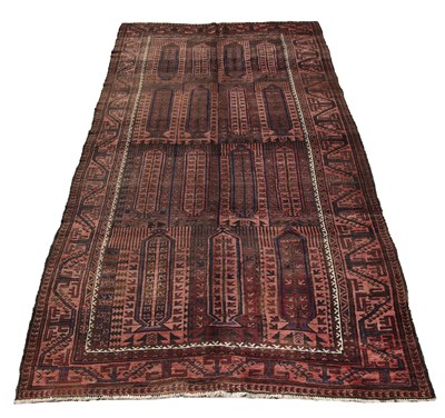 Lot 232 - An Afghan Baluch Carpet of traditional design....