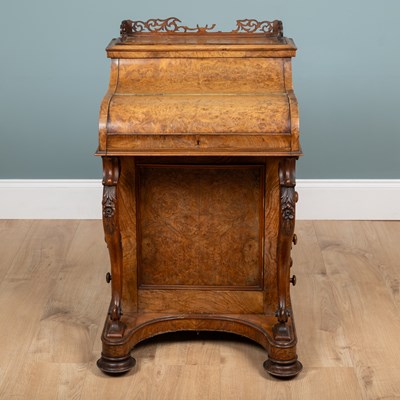 Lot 372 - A Vitorian burr walnut piano-top Davenport