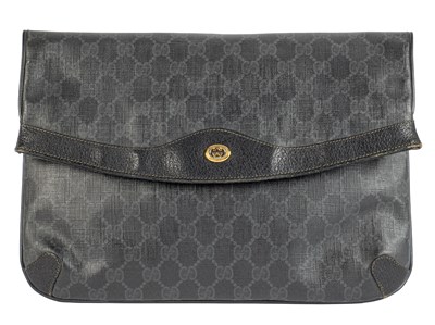 Lot 322 - A black Gucci clutch bag in GG Monogram coated...