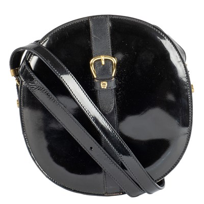 Lot 331 - A black patent leather, cross body, oval...