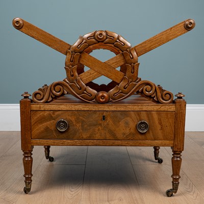 Lot 429 - A Georgian walnut X-frame Canterbury