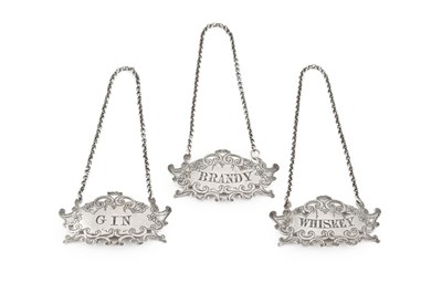 Lot 510 - A set of three mid-Victorian silver decanter...