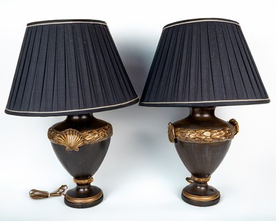 Lot 90 - A pair of French Empire-style black and gold painted ceramic table lamps