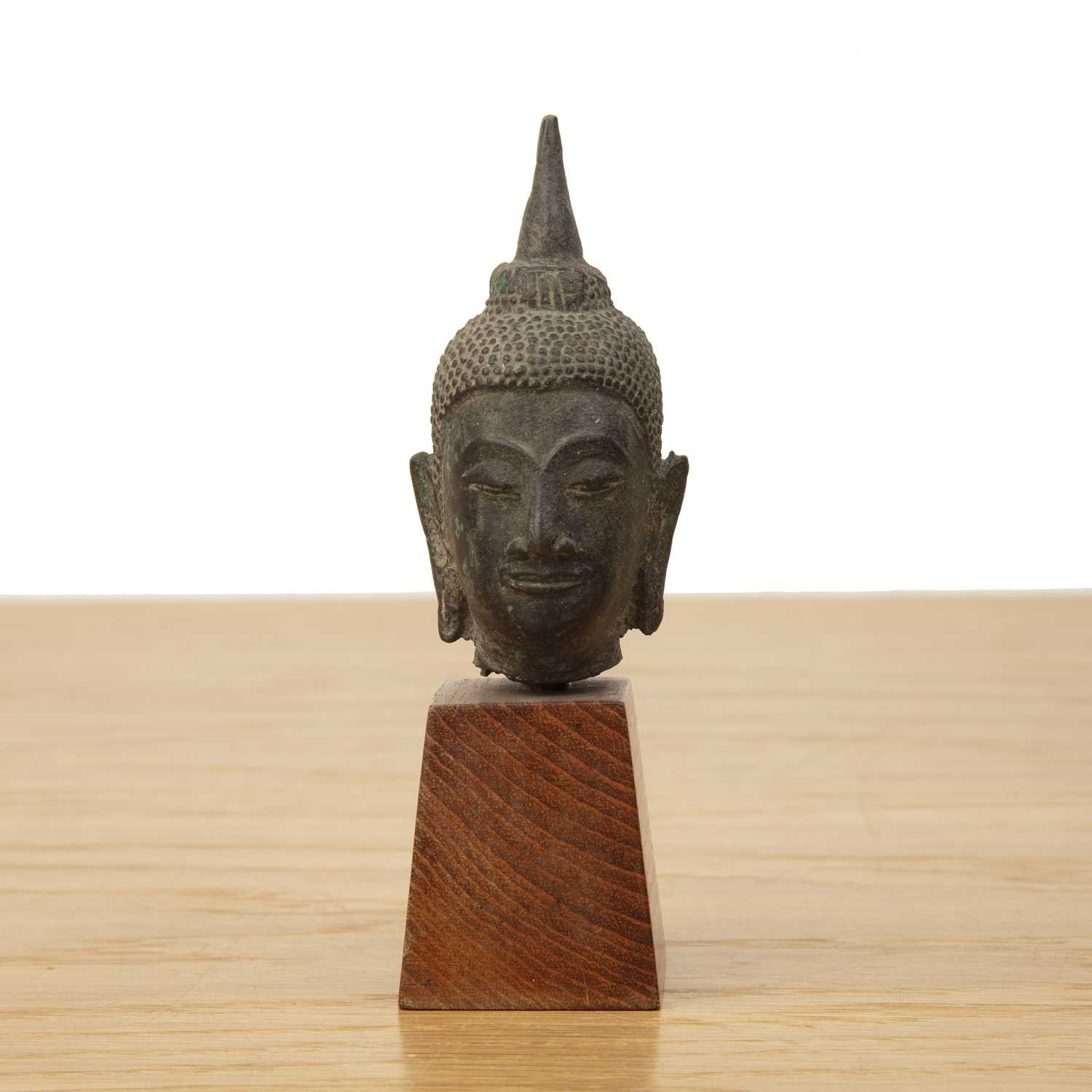 Lot 421 - Small bronze model of a Buddha's head Thailand...