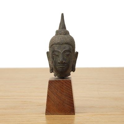 Lot 421 - Small bronze model of a Buddha's head Thailand...