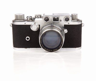 Lot 311 - A Leica IIIc 1949 camera 470435 with a Leitz...