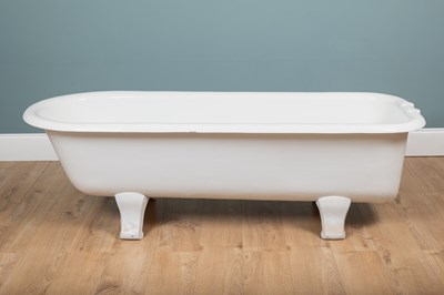 Lot 1515 - A white enamelled cast iron bathtub