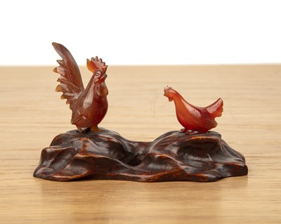 Lot 235 - Two agate model chickens Chinese on a carved...