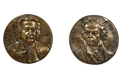 Lot 334 - Two brass moulded roundels depicting the busts of famous composers