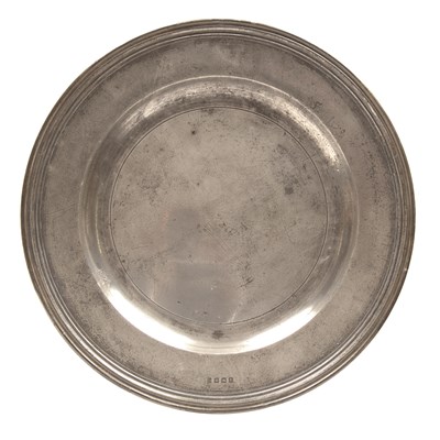 Lot 284 - An English pewter multiple reeded charger by...