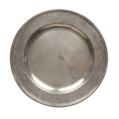 Lot 285 - An English pewter multiple reeded charger by...