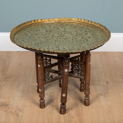 Lot 293 - A Middle Eastern-style brass-topped tray table