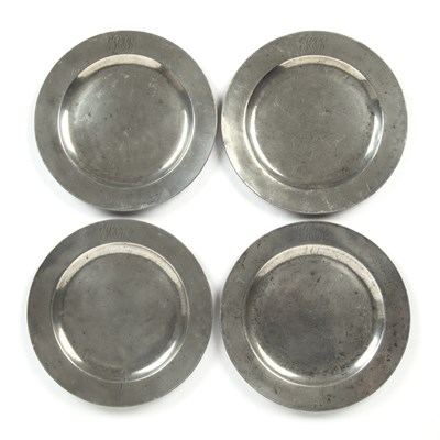 Lot 291 - A set of 4 English pewter plain rim plates by...