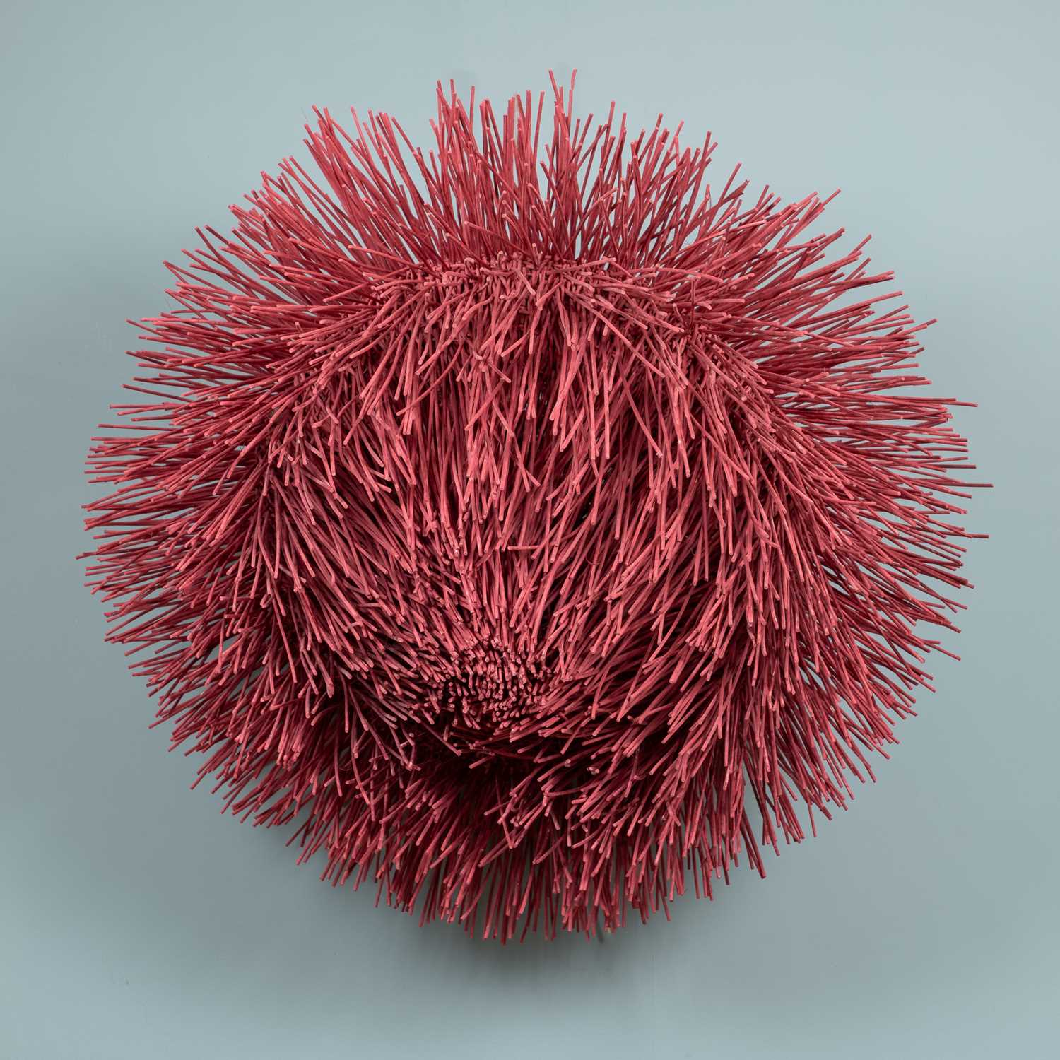 Lot 203 - A red painted wicker sea Urchin