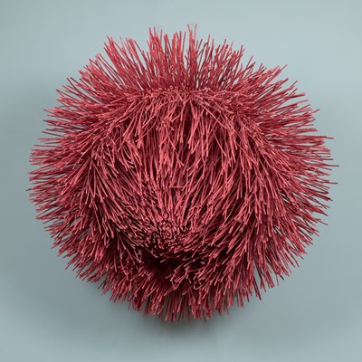 Lot 203 - A red painted wicker sea Urchin
