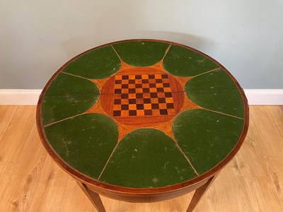 Lot 469 - A Georgian mahogany demi-lune card table