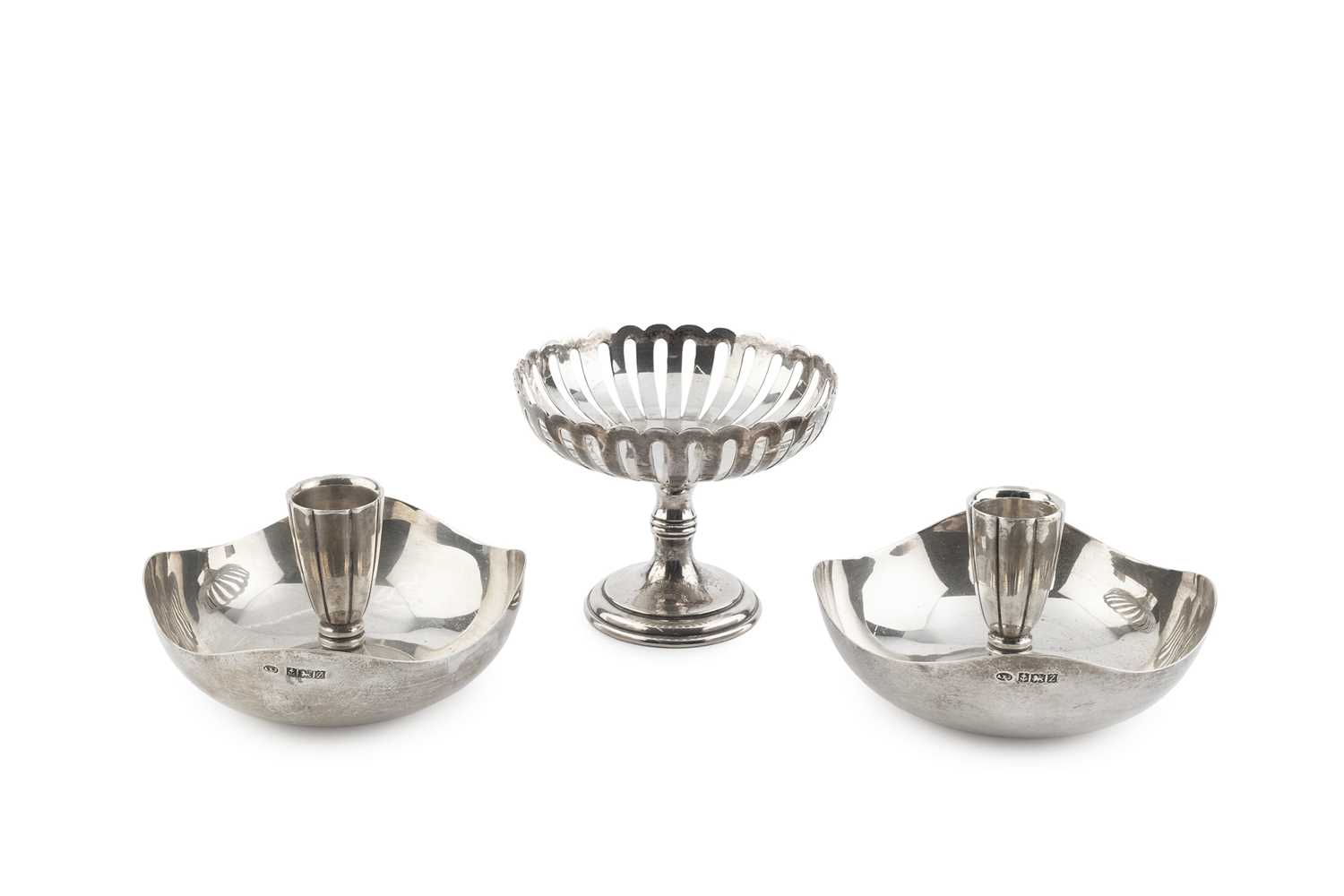 Lot 180 - A pair of silver dished candle holders, of...