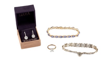 Lot 70 - A tanzanite and diamond bracelet, designed as...