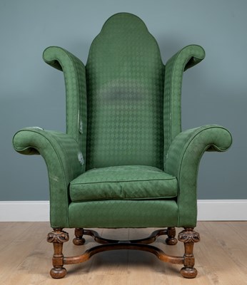 Lot 92 - A wingback armchair in an exaggerated Georgian style