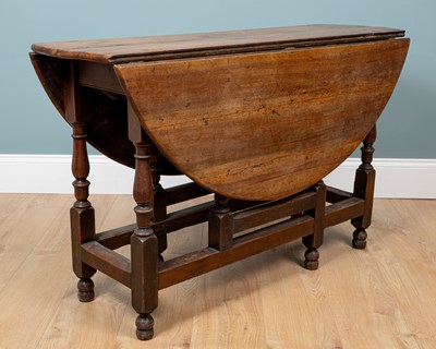 Lot 1220 - An 18th century fruitwood gateleg table