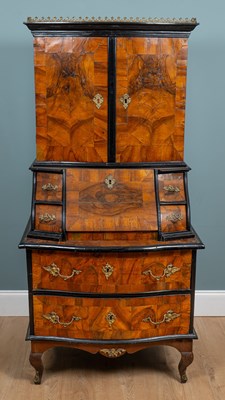 Lot 431 - A French or German early 19th century walnut and ebonised bureau cabinet