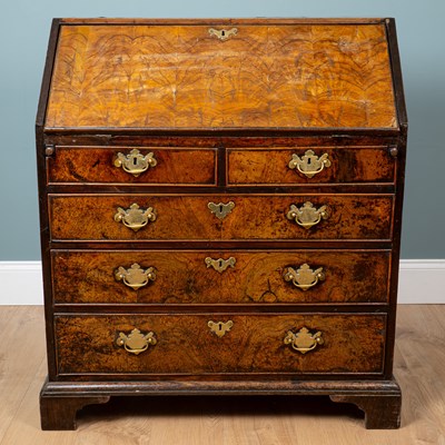 Lot 1093 - A George II walnut bureau