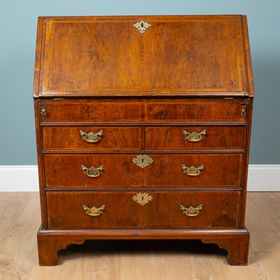 Lot 77 - A George II walnut bureau