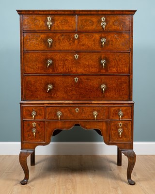 Lot 68 - A Queen Anne walnut and burr walnut veneered chest on stand