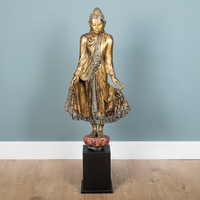 Lot 1074 - A 20th century Burmese gilt carved wood figure of Buddha